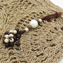 Load image into Gallery viewer, HANDWOVEN CROCHET RAFFIA TOTE BAG I LIGHTWEIGHT SUMMER PURSE WITH BEADED CHARM I BOHO STYLE OPEN KNIT HAND BAG I NATURAL FIBER BAG WITH CHARM