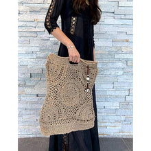 Load image into Gallery viewer, HANDWOVEN CROCHET RAFFIA TOTE BAG I LIGHTWEIGHT SUMMER PURSE WITH BEADED CHARM I BOHO STYLE OPEN KNIT HAND BAG I NATURAL FIBER BAG WITH CHARM